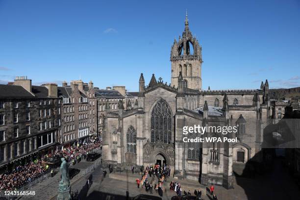 Britain's King Charles III sitting in the lead car, leaves St. Giles' Cathedral, following the service for Britain's late Queen Elizabeth II on...
