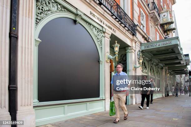 Fortnum and Mason's on Piccadilly pay tribute by blacking out their window display on 12th September 2022 in London, United Kingdom. Queen Elizabeth...