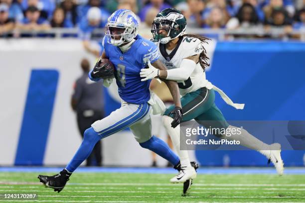 Wide receiver DJ Chark of the Detroit Lions runs the ball under the pressure of cornerback Avonte Maddox of the Philadelphia Eagles during an NFL...