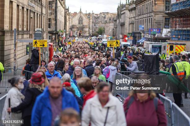 People queue to view the late Queen Elizabeth II's coffin at St Giles Cathedral on September 12, 2022 in Edinburgh, Scotland. King Charles III joins...