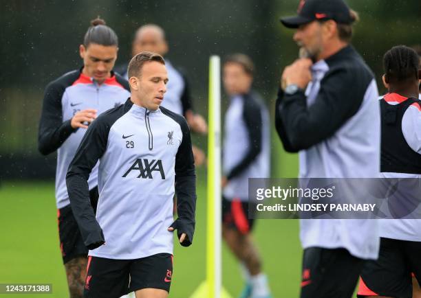 Liverpools Brazilian midfielder Arthur Melo takes part in a training session at the AXA Training Centre in Kirkby, north of Liverpool in north-west...
