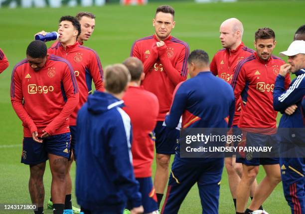 Ajaxs Argentinian midfielder Lucas Ocampos takes part in a training session at the Anfield Stadium in Liverpool, north-west England, on September 12...