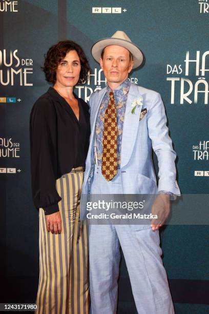 Nina Kunzendorf and Alexander Scheer attend the "Das Haus der Träume" premiere at Kino International on September 12, 2022 in Berlin, Germany.