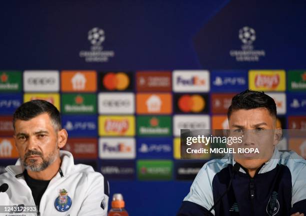 Porto's Colombian midfielder Mateus Uribe and FC Porto's Portuguese coach Sergio Conceicao address a press conference at the Dragao Stadium in Porto,...