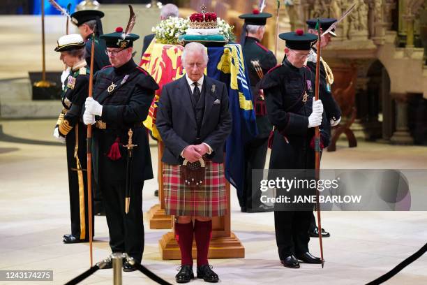 Britain's King Charles III attends a Vigil at St Giles' Cathedral, in Edinburgh, on September 12 following the death of Queen Elizabeth II on...