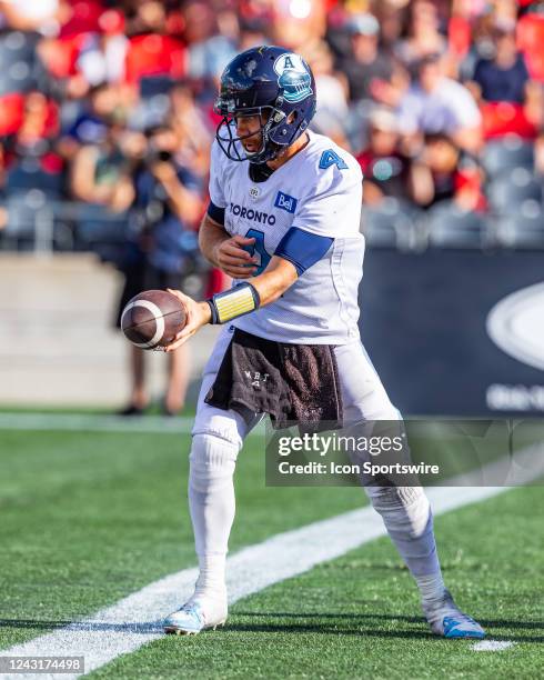 Toronto Argonauts quarterback McLeod Bethel-Thompson looks to hand off the ball to a running back during Canadian Football League action between the...