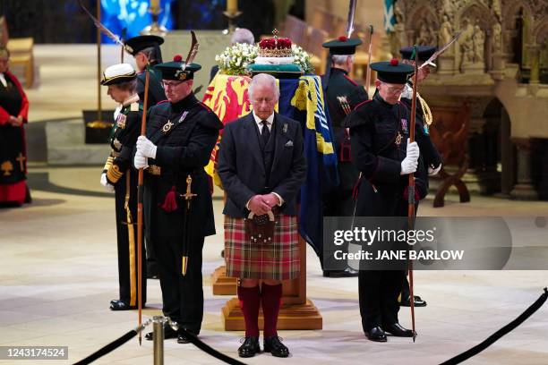 Britain's King Charles III attends a Vigil at St Giles' Cathedral, in Edinburgh, on September 12 following the death of Queen Elizabeth II on...