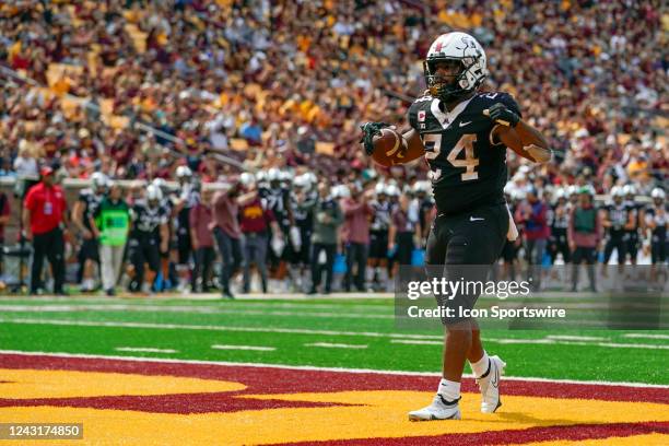 Minnesota Golden Gophers running back Mohamed Ibrahim celebrates his 1-yard touchdown run during the third quarter of a college football game between...