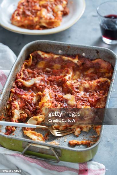 lasagna in a baking tray ready to eat - serving lasagna stock pictures, royalty-free photos & images