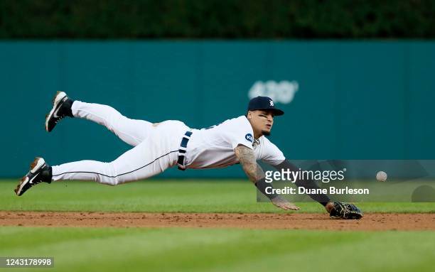 Shortstop Javier Baez of the Detroit Tigers cant make a diving catch on a single hit by Yordan Alvarez of the Houston Astros during the third inning...