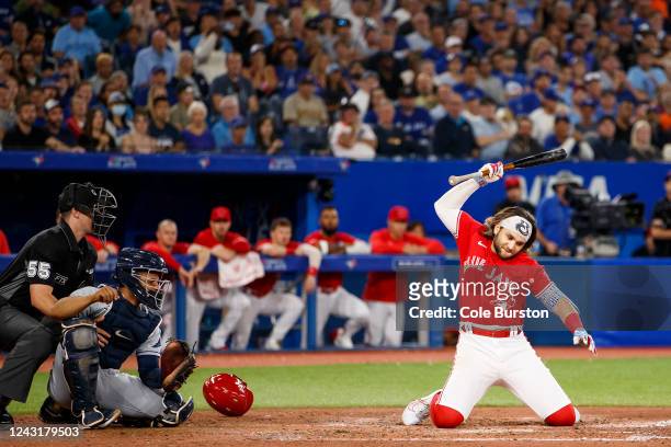 Bo Bichette of the Toronto Blue Jays reacts after a high pitch in the sixth inning against catcher Francisco Mejia of the Tampa Bay Rays at Rogers...