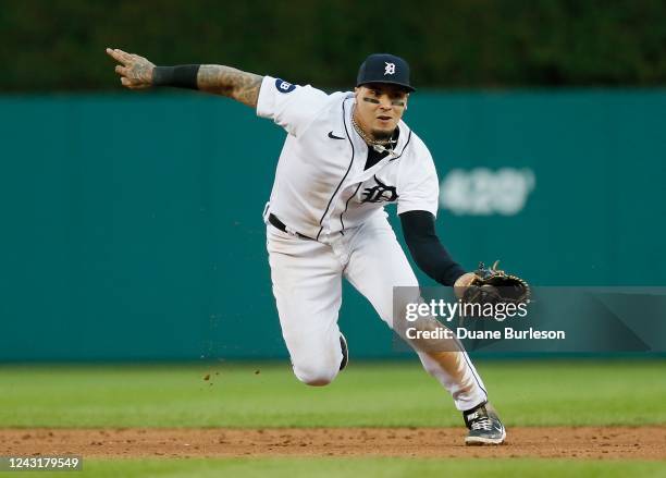 Shortstop Javier Baez of the Detroit Tigers fields a grounder hit by Kyle Tucker of the Houston Astros and throws him out at first base during the...