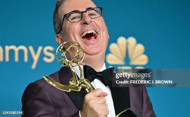 British-US comedian John Oliver poses with the Emmy for Outstanding Variety Talk Series for "Last Week Tonight With John Oliver" during the 74th Emmy...