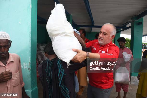 Kerem Kinik, President of Turkish Red Crescent distributes relief items and pledges all assistance to the Pakistan Red Crescent for flood victims in...