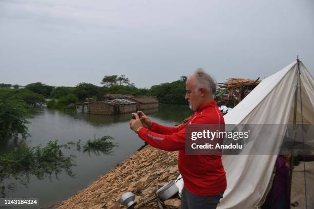 Kerem Kinik, President of Turkish Red Crescent distributes relief items and pledges all assistance to the Pakistan Red Crescent for flood victims in...