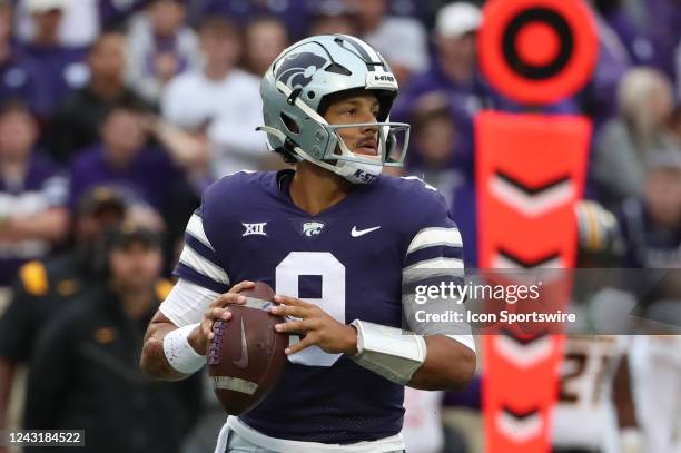 Kansas State Wildcats quarterback Adrian Martinez drops back to pass in the first quarter of a college football game between the Missouri Tigers and...