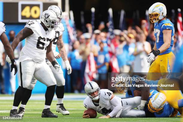 Raiders quarterback Derek Carr is sacked by Los Angeles Chargers defensive tackle Sebastian Joseph-Day during the first half of a NFL football game...
