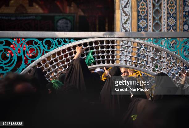 Shi'ite pilgrims pray as they gather in front of the holy shrine of Hazrat Abalfazl Al- Abbas during the commemoration of Arbain in the holy city of...