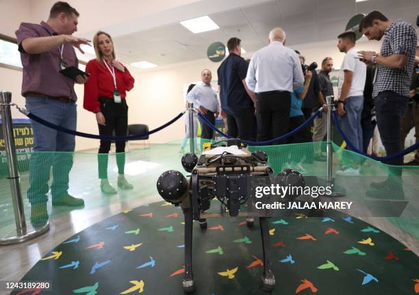 An autonomous robotic dog used in civilian and military operations, produced by the Israeli defence contractor Rafael, is presented at an exhibition...