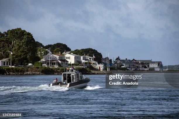 Ship passes under the Cape Cod Canal Railroad Bridge in Bourne, Massachusetts on August 30, 2022. The Cape Cod Canal is a seven mile long man made...