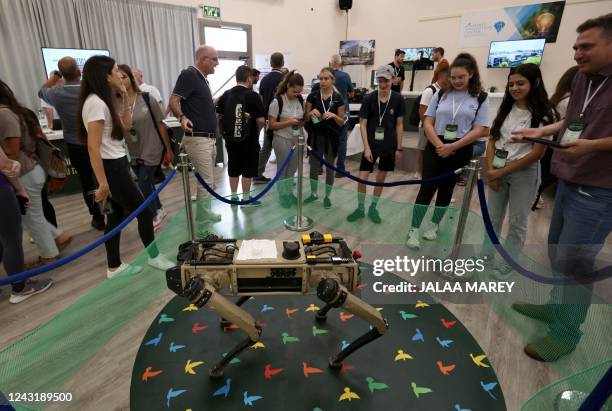 An autonomous robotic dog used in civilian and military operations, produced by the Israeli defence contractor Rafael, is presented at an exhibition...