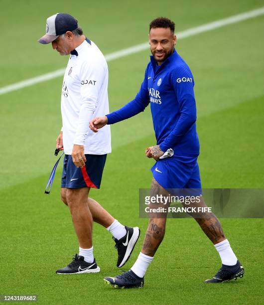 Paris Saint-Germain's French head coach Christophe Galtier and Paris Saint-Germain's Brazilian forward Neymar arrive for a training session at the...