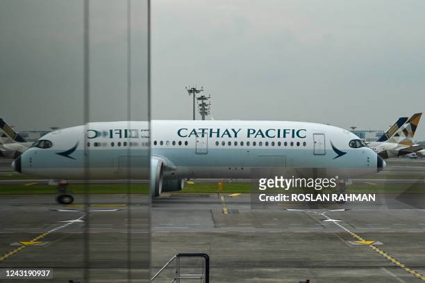 Cathay Pacific passenger plane arrives at the reopened Singapore Changi Airport Terminal 4 in Singapore on September 13 following its closure for...