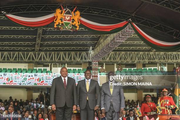 Kenya President William Ruto , Kenya Deputy President Rigathi Gachagua and former president Uhuru Kenyatta stand at the Moi International Sports...