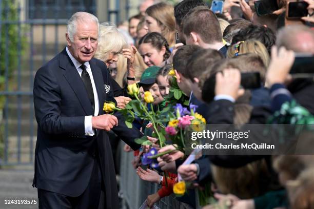 His Majesty King Charles III accompanied by Camilla, Queen Consort is greeted by members of the public outside Hillsborough Castle on September 13,...