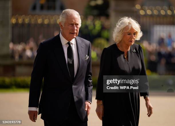 King Charles III and the Queen Consort view floral tributes left outside Hillsborough Castle on September 13, 2022 in Hillsborough, United Kingdom....