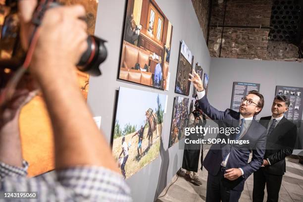 Anadolu Agency General Manager Serdar Karagoz and Anadolu Agency Visual News Editor Firat Yurdakul describe a photograph at the Istanbul Photo Awards...