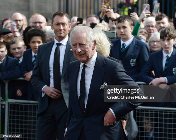 His Majesty King Charles III accompanied by the Queen Consort inspects the floral tributes left for his late mother Her Majesty Queen Elizabeth II...