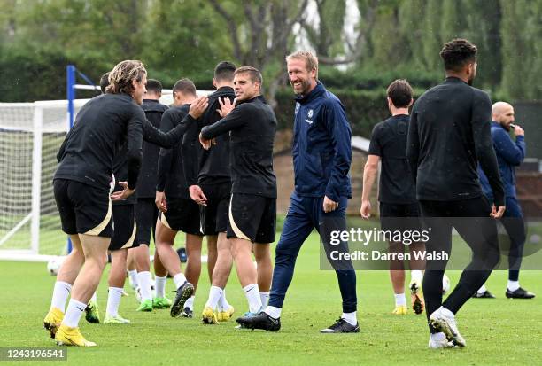 César Azpilicueta and Head Coach Graham Potter of Chelsea during a training session ahead of their UEFA Champions League group E match against FC...