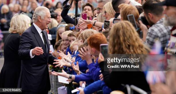 Crowds cheer as King Charles III and Camilla, Queen Consort arrive for a visit to Hillsborough Castle on September 13, 2022 in Hillsborough, United...