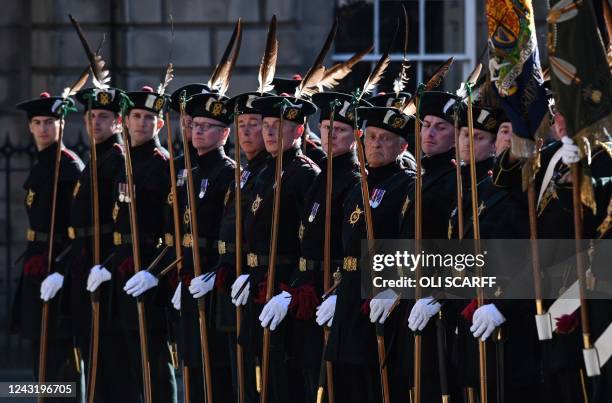 The Royal Company of Archers, The King's Bodyguard for Scotland, stand on guard outside St Giles' Cathedral in Edinburgh on September 13 where Queen...