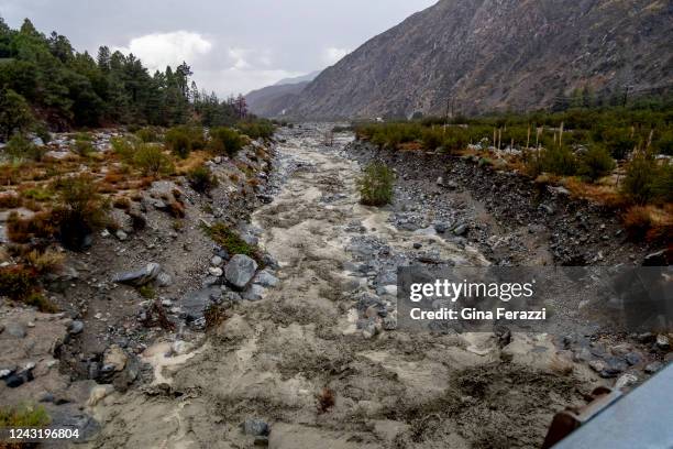 Oak Creek rushes with mud and debris after heavy rains fell in the San Bernardino National Forest creating three large mudslides which are blocking...