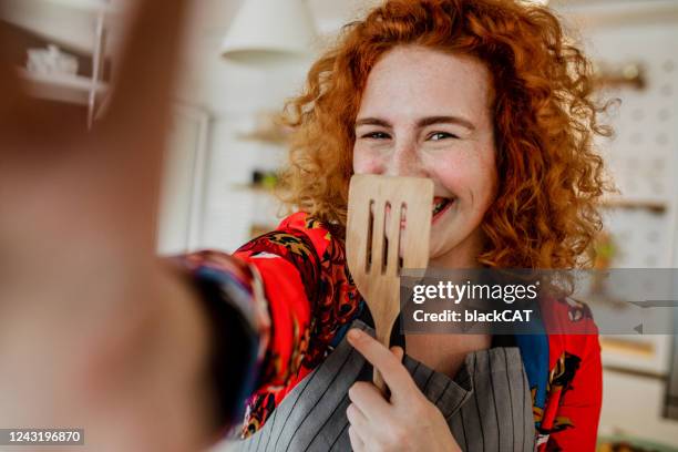 food blogger taking a selfie with a welder - preparing food talking stock pictures, royalty-free photos & images