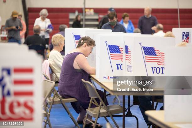 Voter fills out their ballot at Bedford High School during the New Hampshire Primary on September 13, 2022 in Bedford, New Hampshire. In one race,...