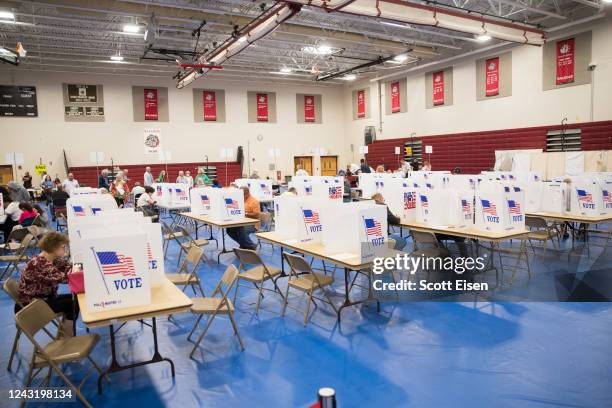 Voters fill out their ballots at Bedford High School during the New Hampshire Primary on September 13, 2022 in Bedford, New Hampshire. In one race,...