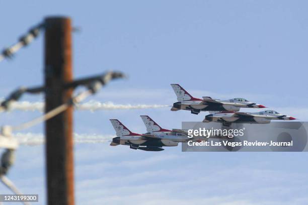 United States Air Force Thunderbirds fly in formation around Nellis Air Force Base in Las Vegas on Wednesday, Feb. 25, 2015.