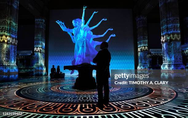 Person attends the Hall des Lumieres immersive digital art debut exhibition Gustav Klimt: Gold in Motion, on September 13 in New York City. - The...