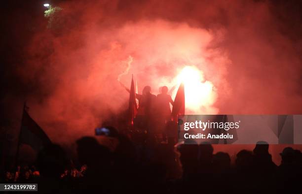 Students burn flares during a protest against a fuel price hike near the presidential palace in Jakarta, Indonesia, on 13 September 2022. More than a...