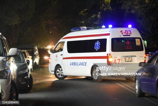 An ambulance moves on a street near a military hospital, where servicemen wounded in night border clashes between Armenia and Azerbaijan receive...