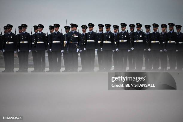 The Queen's Colour Squadron, RAF, prepare for the arrival of the coffin of Queen Elizabeth II at the Royal Air Force Northolt airport on September 13...