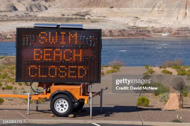 Swimming beach is closed as Lake Powell continues to shrink on September 3, 2022 near Page, Arizona. The light colored "bathtub ring" above the...