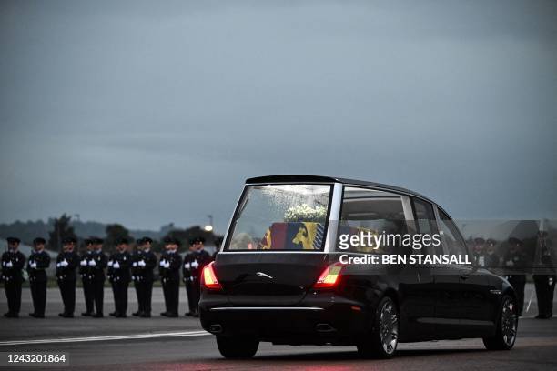 The Royal Hearse departs, carrying the coffin of Queen Elizabeth II away from the Royal Air Force Northolt airbase on September 13 to Buckingham...