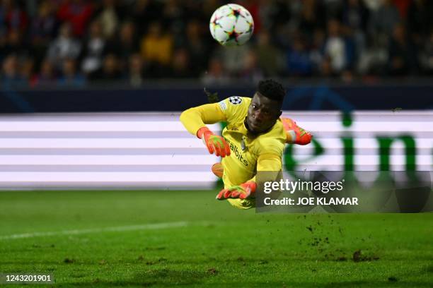 Inter Milan's Cameroonian goalkeeper Andre Onana jumps to save the ball during the UEFA Champions League Group C football match between Viktoria...