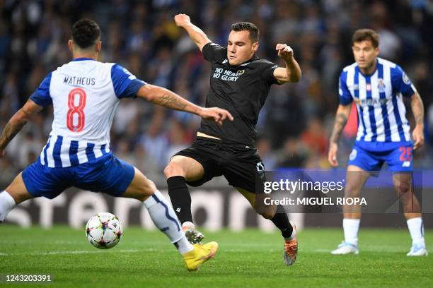 Porto's Colombian midfielder Mateus Uribe Club Brugge's Spanish forward Ferran Jutgla during the Champions League, group B, first leg football match...