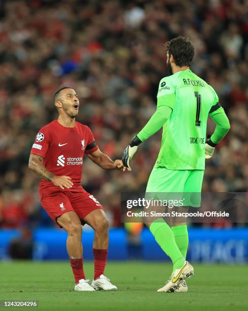 Thiago Alcantara of Liverpool celebrates their 1st goal with goalkeeper Alisson Becker during the UEFA Champions League group A match between...