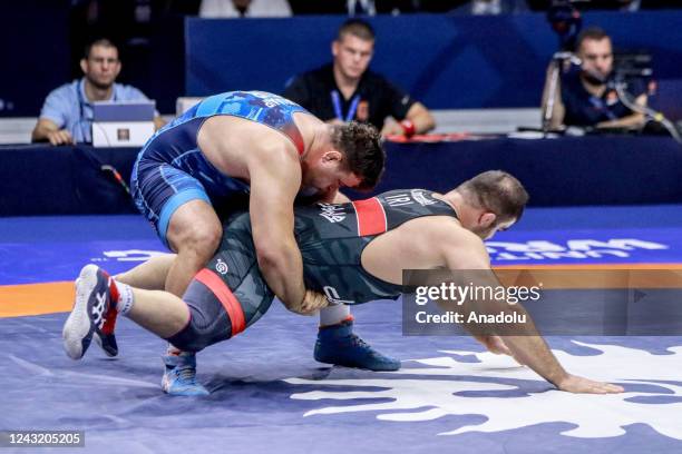 Turkish wrestler Riza Kayaalp in action against Amin Mirzazadeh of Iran during the 130kilos Men's Greco-Roman style final at the World Wrestling...